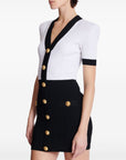 Balmain Two-tone twisted knit bodycon dress