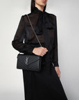 Saint Laurent Clutch with chain Cassandre black