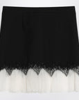 Alexander McQueen Mini skirt with black/ivory spider lace