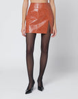 THE ANDAMANE Leather-effect mini skirt in tan