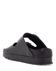 Birkenstock black leather platform sandals with two straps and metal buckles