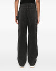 Golden Goose jeans with distressed effect and front patches