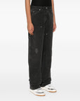 Golden Goose jeans with distressed effect and front patches