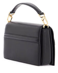 Toteme mini t-flap bag in black calfskin with adjustable strap