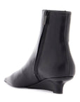 Toteme elegant and modern black leather ankle boots with zip