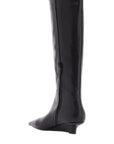 Toteme black leather knee-high boots with low heel and pointed toe