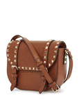 Valentino Garavani small messenger crossbody bag in brown hammered leather with studs