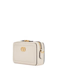 Valentino Garavani mini camera case in ivory leather with adjustable strap and golden details