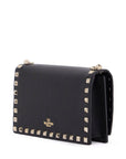 Valentino Garavani mini black leather bag with golden metal studs