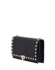 Valentino Garavani mini black leather bag with golden metal studs