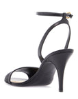 Valentino Garavani black goat leather sandals with gold buckle and stiletto heel