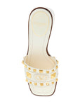 Valentino Garavani ivory leather slippers with golden studs and low heel