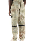 Stone Island econyl printed dissolving grid camo pants