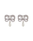 Alessandra Rich hypoallergenic brass earrings in silver with bow and drop pearl