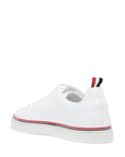 Thom Browne smooth leather sneakers with tricolor detail.