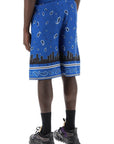 Off-White bermuda shorts with paisley pattern